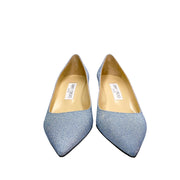 Pair of Jimmy Choo Aza 50 light blue glitter pumps displayed together pointing forward with beige leather lining.