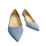 Angled studio shot of Jimmy Choo Aza 50 light blue glitter heels showcasing the sleek silhouette and pointed toe.