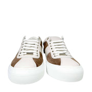 Front view of a pair of Jimmy Choo Portman white leather and brown suede sneakers showing white laces.