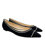Three-quarter view of Jimmy Choo Romy black suede flats showcasing the pearl-trim neckline and low flat profile.