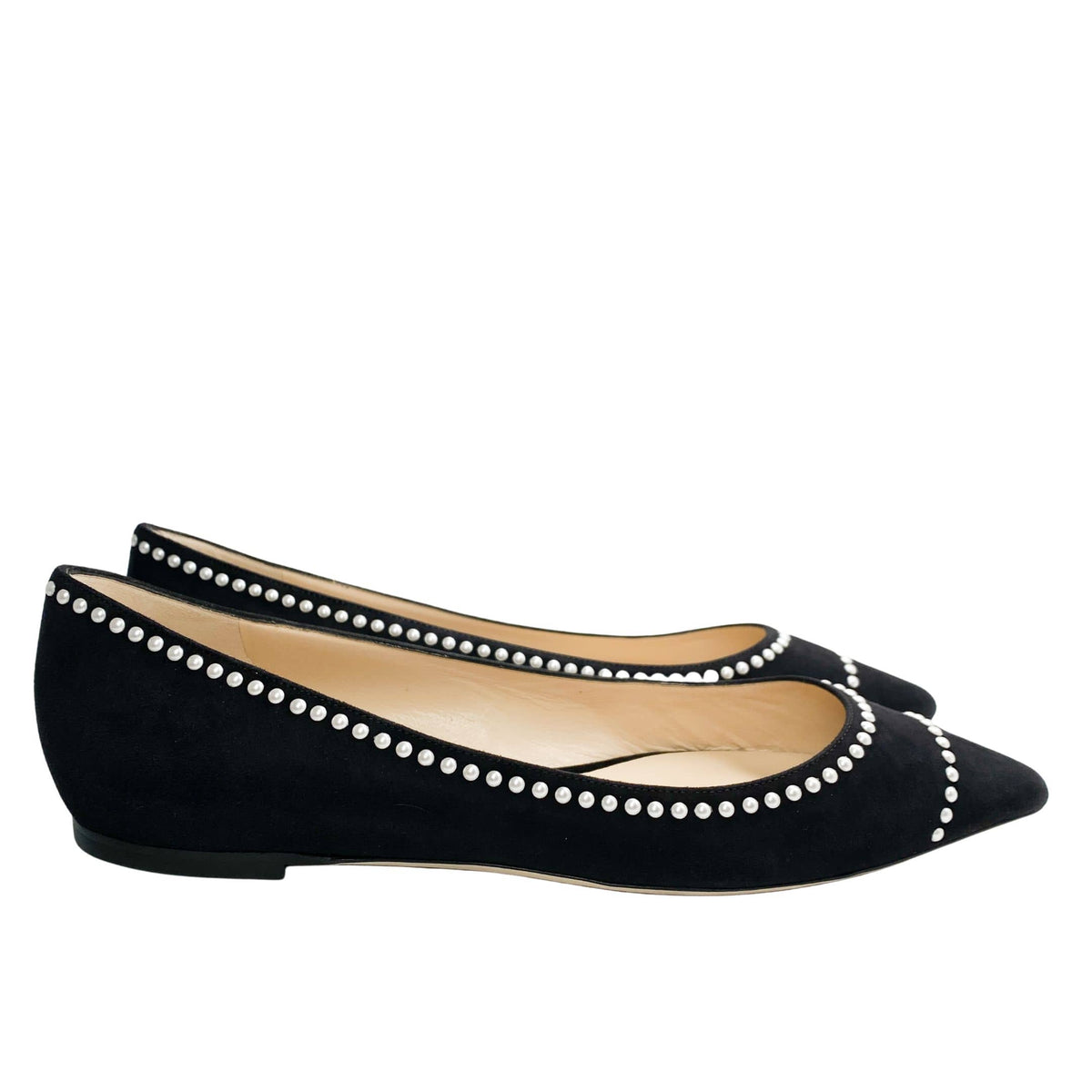 Side profile view of Jimmy Choo Romy pearl-embellished ballet flats displaying sleek low-cut vamps and smooth black suede.
