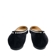 Back view of a pair of Jimmy Choo Romy black suede flats showing the structured heel counters and pearl-lined edges.