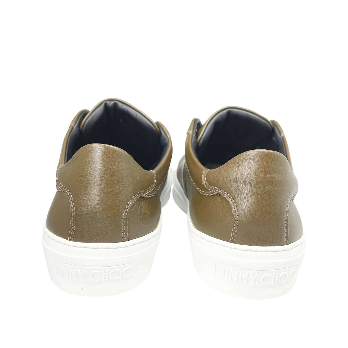 Back view of Jimmy Choo Portman olive green sneakers showing leather heel counters and thick white rubber soles.