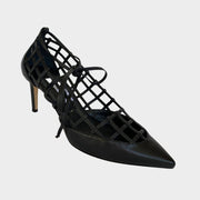Side profile of Jimmy Choo Soraya 65 cage pumps in black leather featuring a latticed cutout design, pointed toe, and 65mm mid heel.