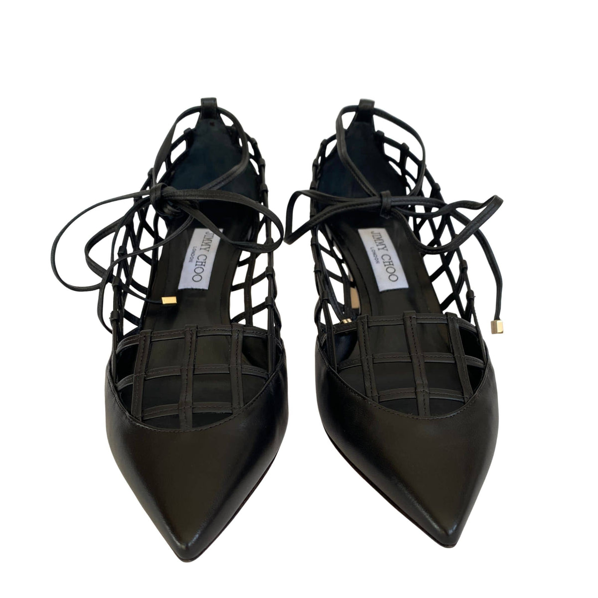 Direct front view of a pair of Jimmy Choo Soraya 65 black leather pointed-toe caged pumps.