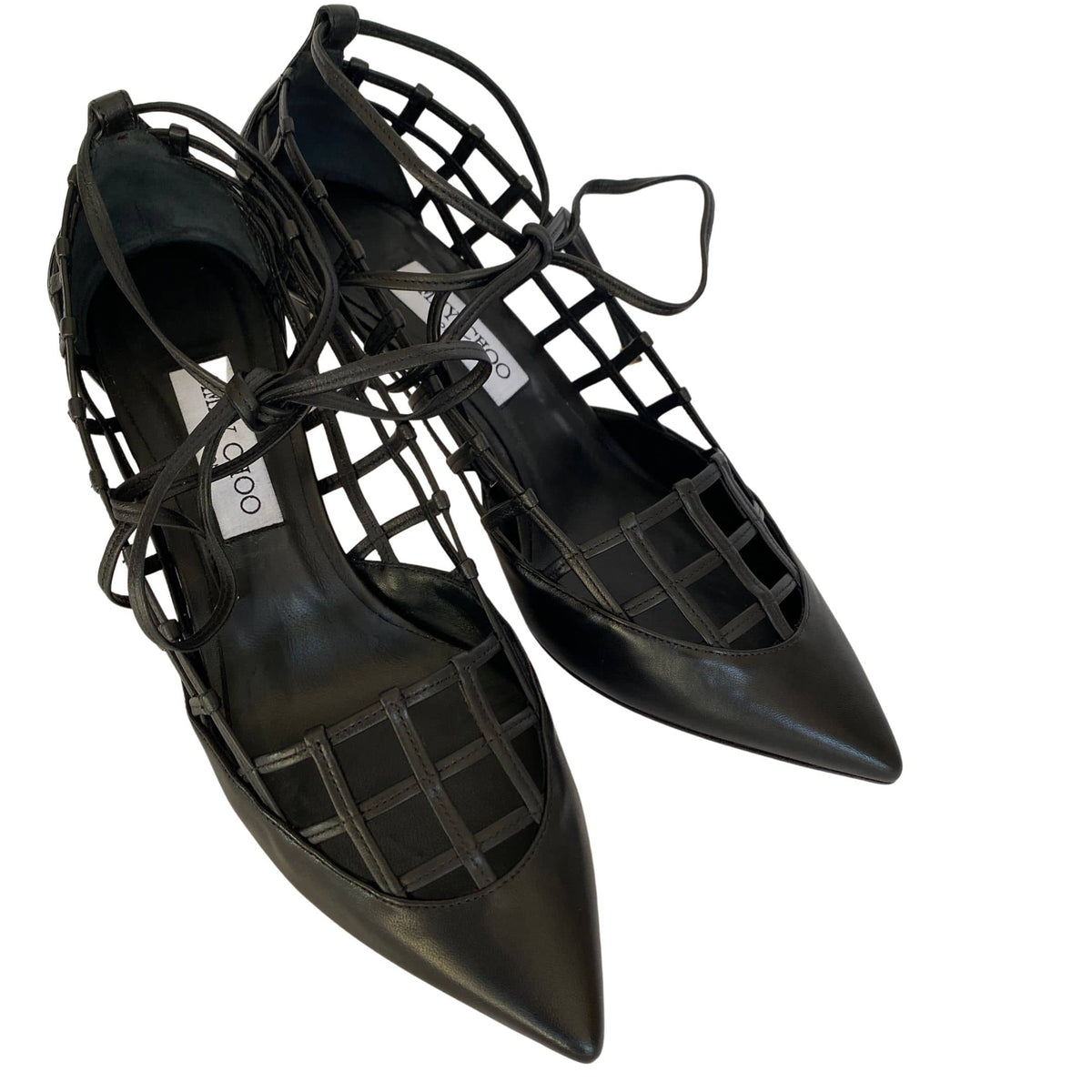 Angled perspective shot of a pair of Jimmy Choo Soraya 65 black leather lattice dress heels.