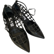 Angled perspective shot of a pair of Jimmy Choo Soraya 65 black leather lattice dress heels.