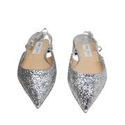 Direct front pair view of Jimmy Choo Gemista silver glitter pointed-toe flats displayed on a clean studio background.