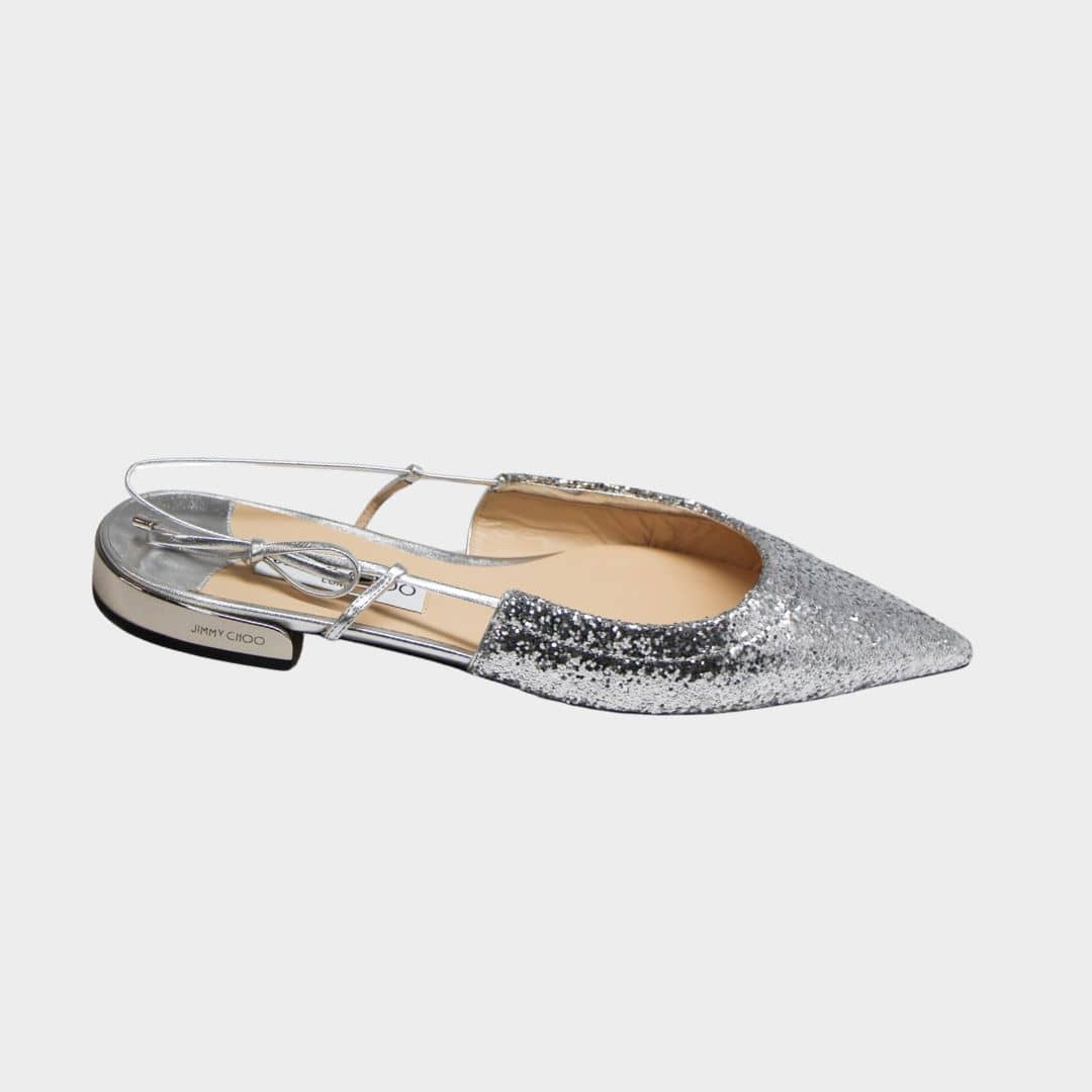 Side profile view of Jimmy Choo Gemista slingback flats in sparkling silver glitter featuring a sleek pointed toe and low heel.