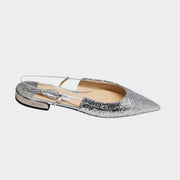 Side profile view of Jimmy Choo Gemista slingback flats in sparkling silver glitter featuring a sleek pointed toe and low heel.