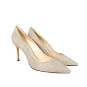 Three quarter studio shot of Jimmy Choo Romy 85 shimmer suede heels