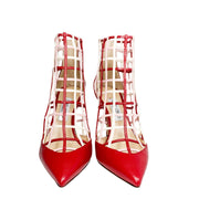 Direct front view of a pair of Jimmy Choo Sheldon 100 red leather lattice high heels showing the sharp pointed toe box.