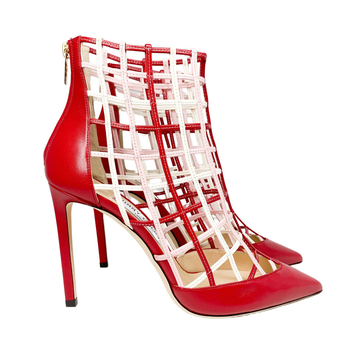 Side profile view highlighting the intricate laser-cut leather lattice structure and sleek silhouette of the red Jimmy Choo Sheldon 100 heel.