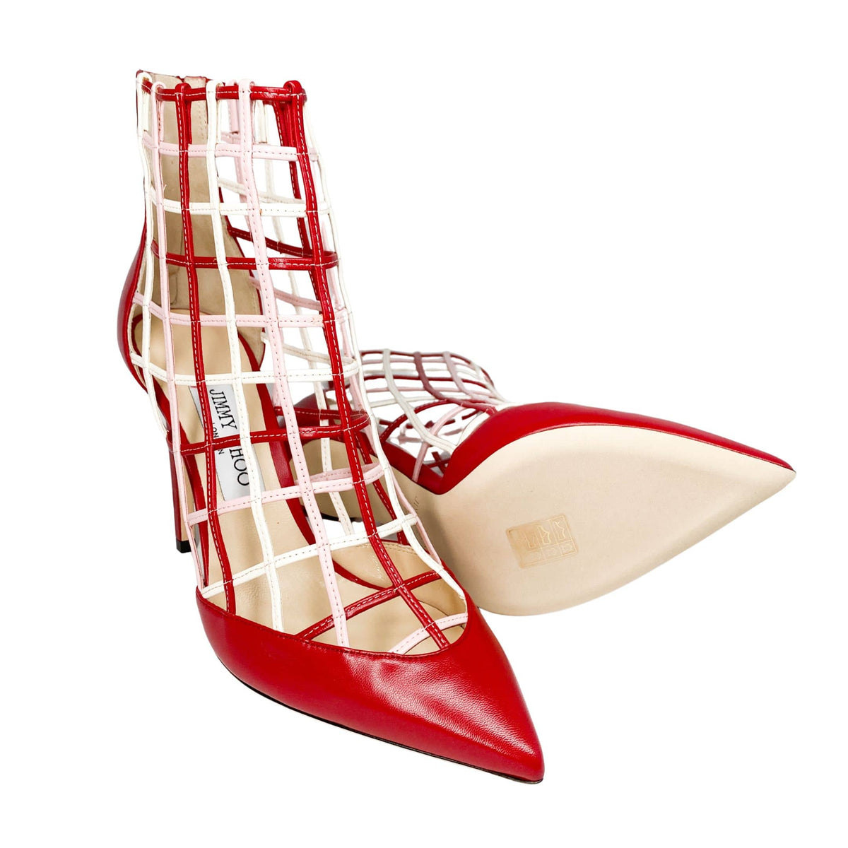 Pair perspective of Jimmy Choo Sheldon 100 red leather cutout stiletto boots displayed together.