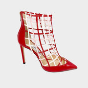 Side profile of Jimmy Choo Sheldon 100 cage pumps in bright red leather featuring a sculptural lattice design, pointed toe, and 100mm stiletto heel.