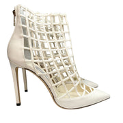 Pair perspective of Jimmy Choo Sheldon 100 white leather cutout stiletto boots displayed together.