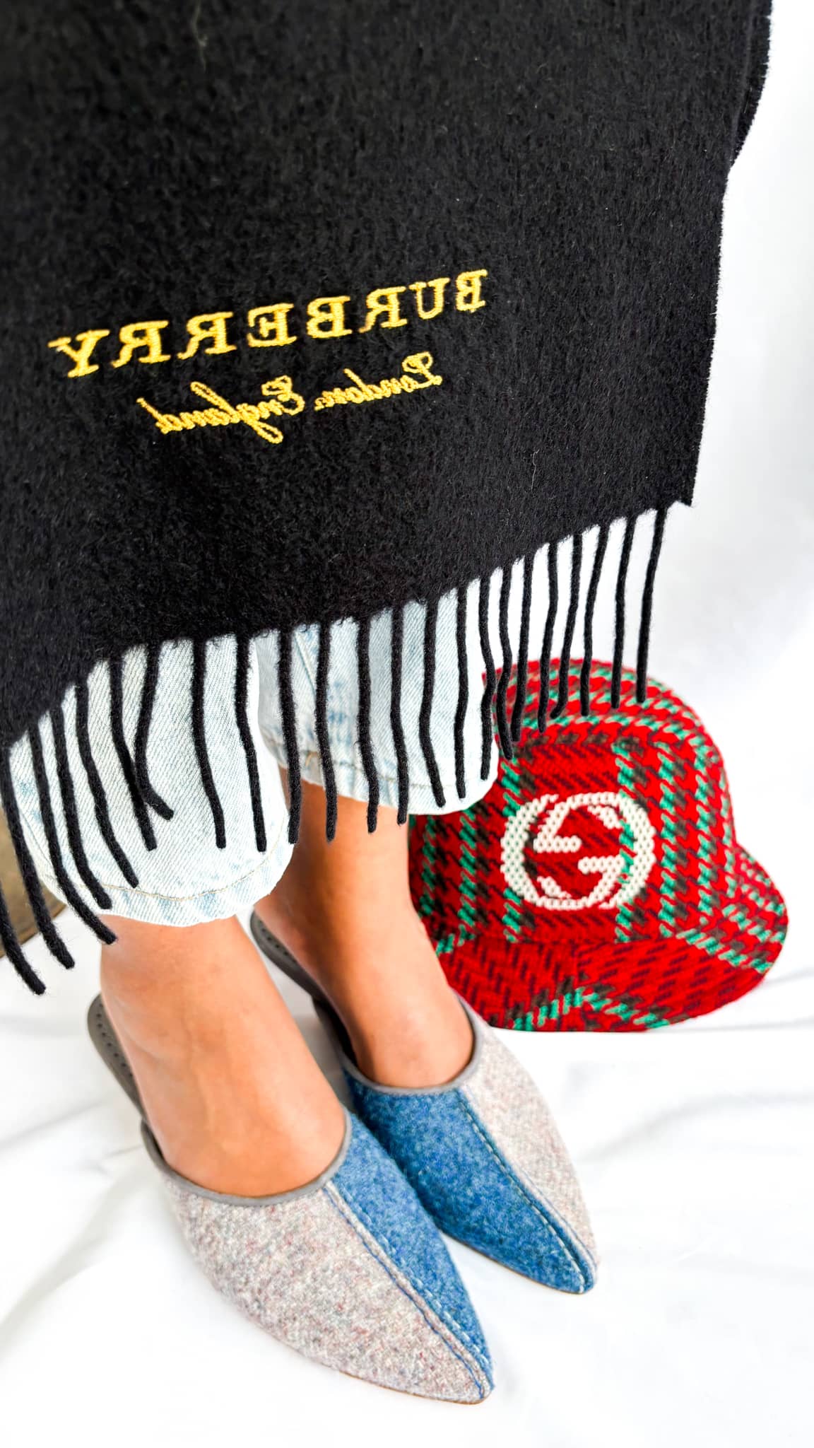 Manolo Blahnik Ajita 30 felt mules presented alongside authentic dust bag packaging.