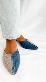 Angled on-foot view of Manolo Blahnik Ajita 30 dark blue and grey wool felt mules displaying the pointed toe and tonal piping.