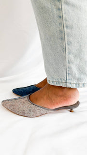 Side profile view on foot showcasing the low 30mm suede kitten heel and soft wool felt upper of the Manolo Blahnik Ajita mule.
