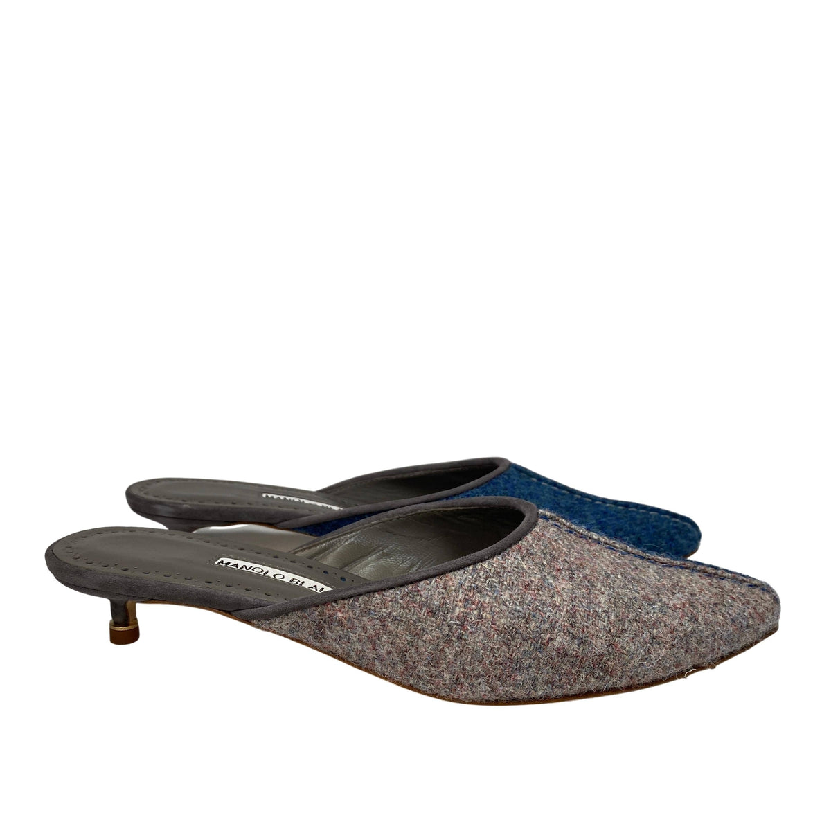 Side profile studio shot of the Manolo Blahnik Ajita 30 mule showcasing the two-tone dark blue and grey wool felt construction.