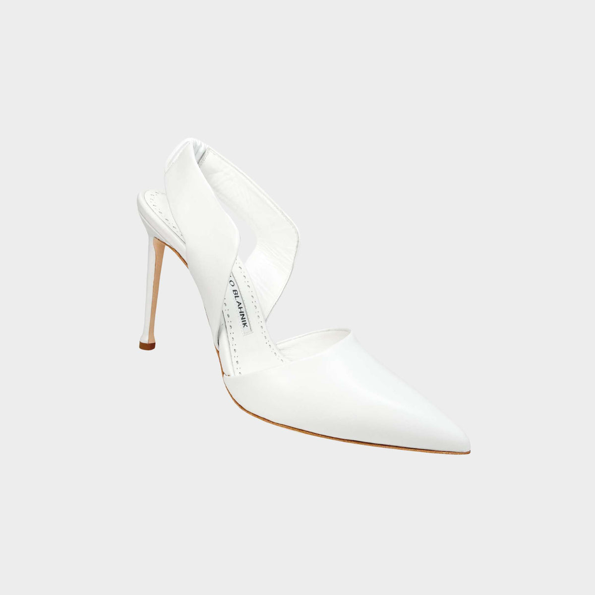 Manolo Blahnik Meana 105 white leather pumps featuring a modern d'Orsay cut and a sleek stiletto heel.