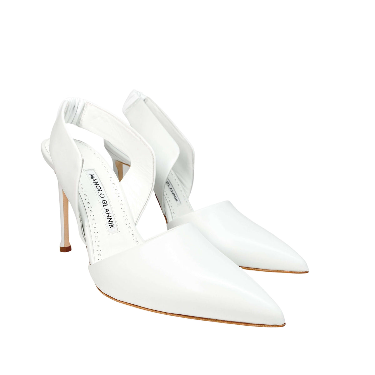 Three-quarter angled view of a pair of white leather Manolo Blahnik Meana 105mm stiletto heels.