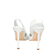 Rear view of the Manolo Blahnik Meana white leather pumps highlighting the minimalist slingback-inspired heel architecture.