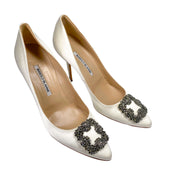 Front view of a pair of Manolo Blahnik Hangisi 105 white satin wedding pumps highlighting the almond toe box design.