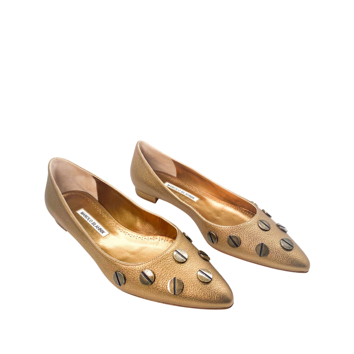 Three-quarter studio view of a pair of Manolo Blahnik Panunzia bronze metallic pointed-toe flats.