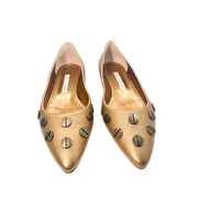 Front pair view of Manolo Blahnik Panunzia bronze leather flats highlighting the pointed toe shape and screw embellishments.