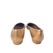 Rear view of Manolo Blahnik Panunzia bronze metallic leather flats showing heel counters and 10mm flat heel design.