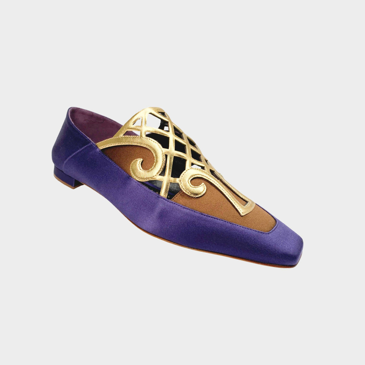 Manolo Blahnik Abukov flats in purple satin with an elegant gold cutout overlay design.