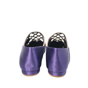 Rear view of the purple satin Manolo Blahnik Abukov slip-on flats highlighting the minimalist heel and back profile.