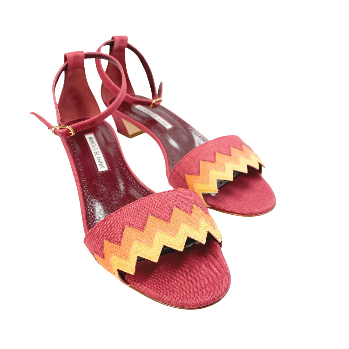 Three-quarter side profile view of Manolo Blahnik Lochpri canvas sandals showcasing the 30mm low kitten heel and slender ankle straps.