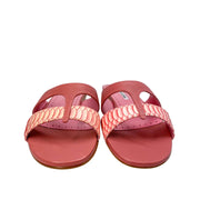 Direct front view of a pair of Manolo Blahnik Popilla pink flat leather slide sandals on a clean background.