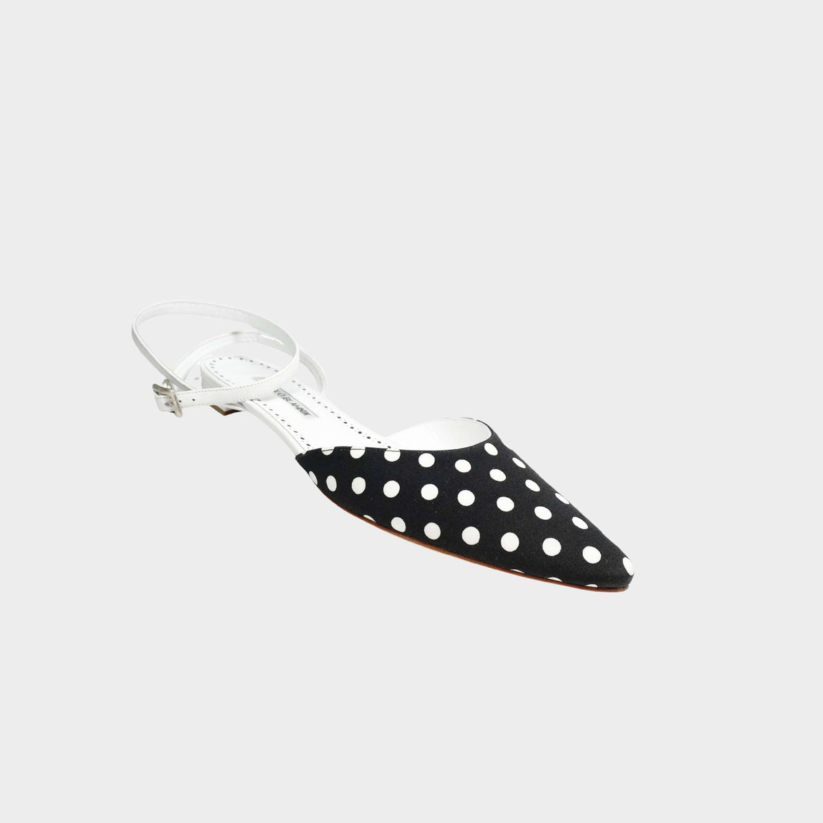 Manolo Blahnik Asensoflat pointed-toe flat shoe in black and white polka dot fabric.