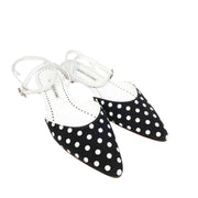 Angled view of the Manolo Blahnik Asenso ankle strap flats showcasing the low half-inch heel and leather trim.