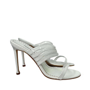 Side profile view of a single Manolo Blahnik Curatora 105 white leather strappy stiletto heel.