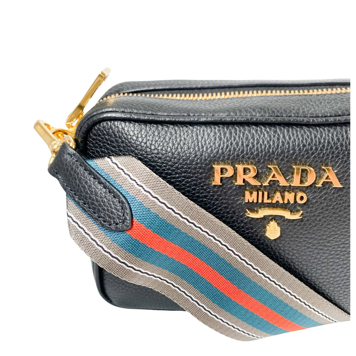Prada camera bag in black leather with gold hardware and webstrap