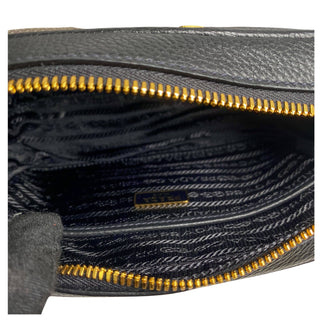 Prada camera bag in black leather with gold hardware and webstrap