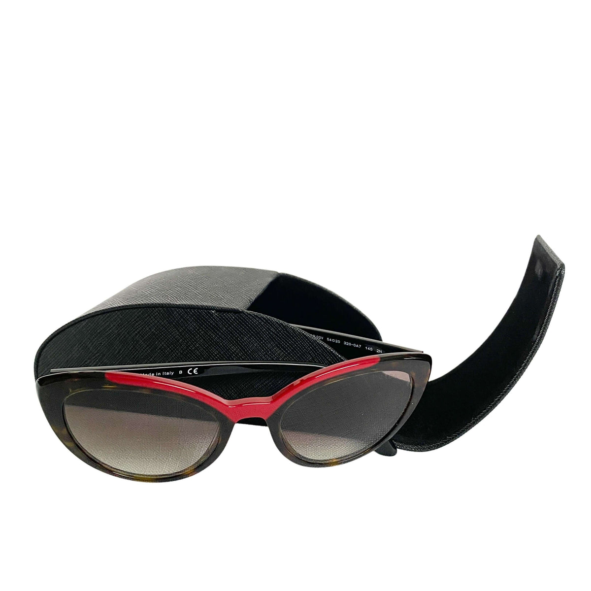 Prada women's tortoise shell sunglasses styled inside open black leather Prada case with microfiber cleaning cloth