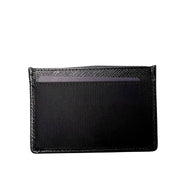 Back view of black Prada Saffiano leather card holder highlighting clean stitching and card slots