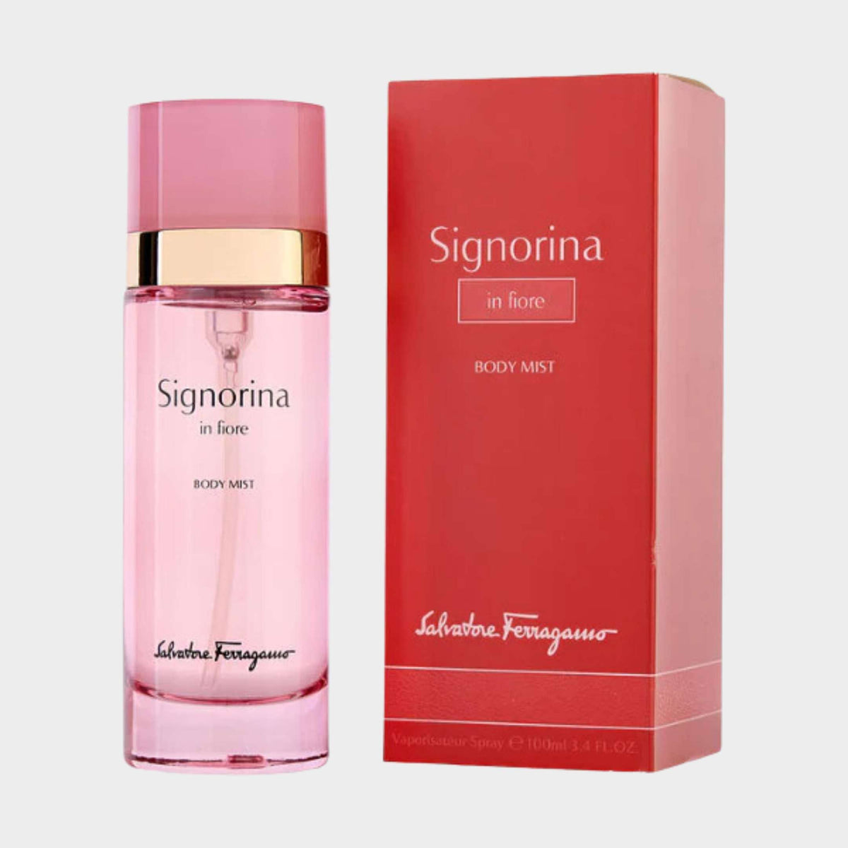 Salvatore Ferragamo Signorina In Fiore Body Mist spray bottle standing next to its pink rectangular retail packaging box.
