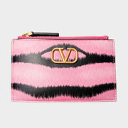 Front view of the Valentino V-Logo coin wallet and card holder in pink and black tiger-striped leather, featuring the signature gold-tone V-Logo emblem