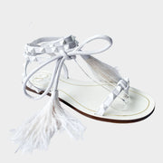 Valentino Garavani Flair white leather lace-up flat sandal featuring signature Rockstuds and white feather accents.
