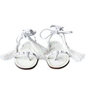 Front view of a pair of Valentino Garavani Flair white leather lace-up sandals with white feathers and signature studs.