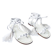 Top-angle pair view of white Valentino Garavani Flair flat sandals displaying delicate lace-up straps and feather trims.