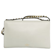 Back view of the off-white Valentino Rockstud clutch showing smooth leather and shoulder strap hooks.