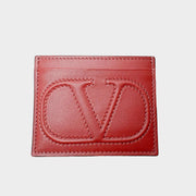 Front view of the Valentino V-Logo card holder in classic red premium leather, showcasing the embossed signature V-Logo.