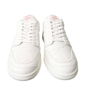 Frontal overhead view of white Valentino Garavani low-top sneakers on a white background.